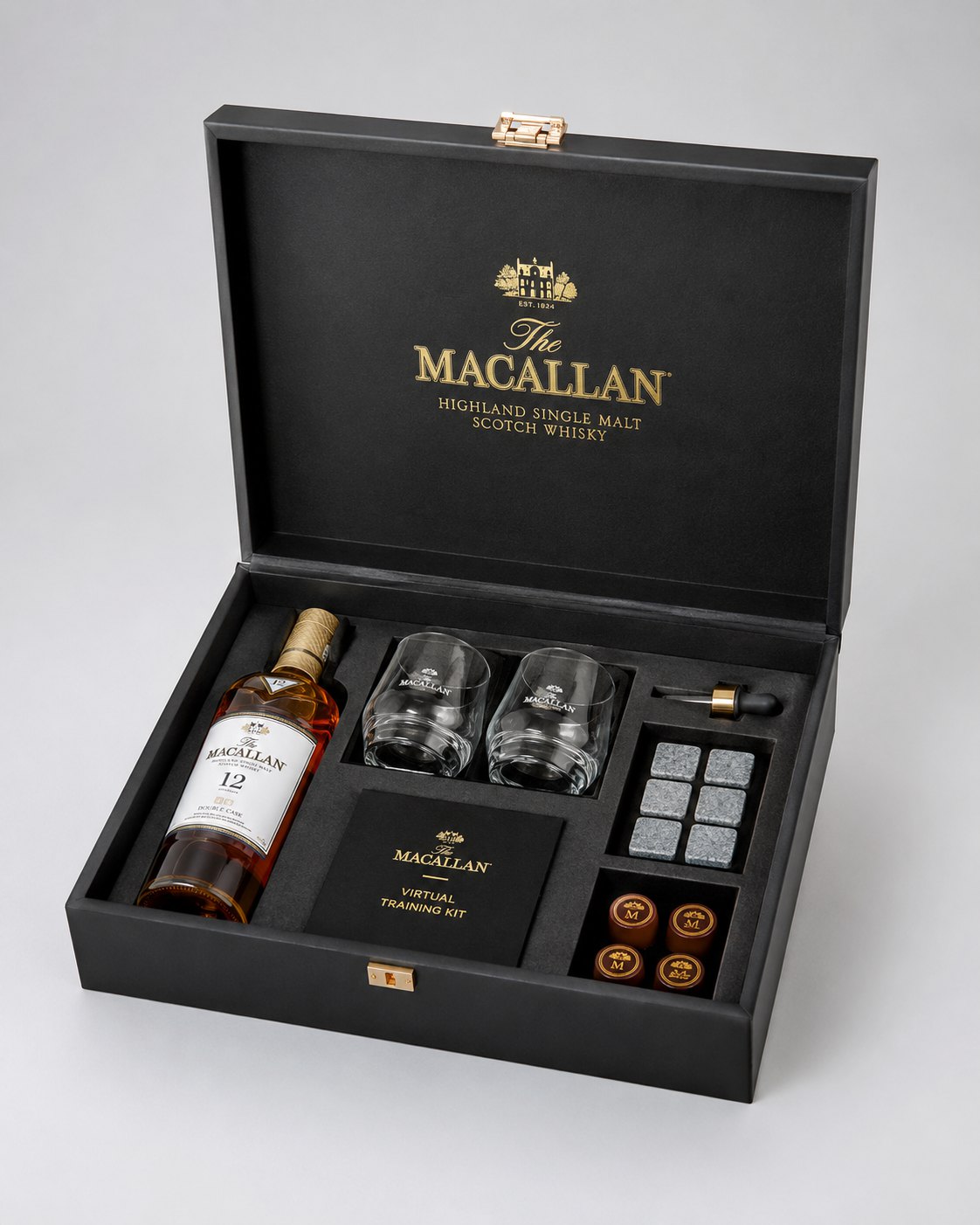 The Macallan virtual training kit in a black case with glasses, whisky stones, and aroma vials