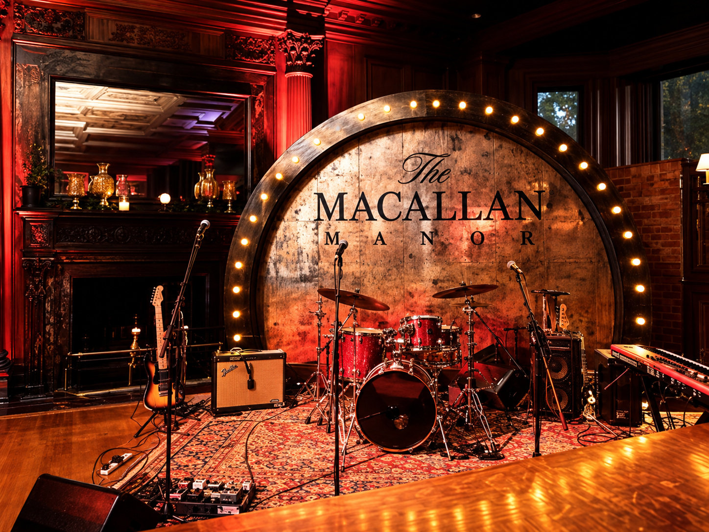 The Macallan Manor stage with illuminated whisky barrel and musical instruments